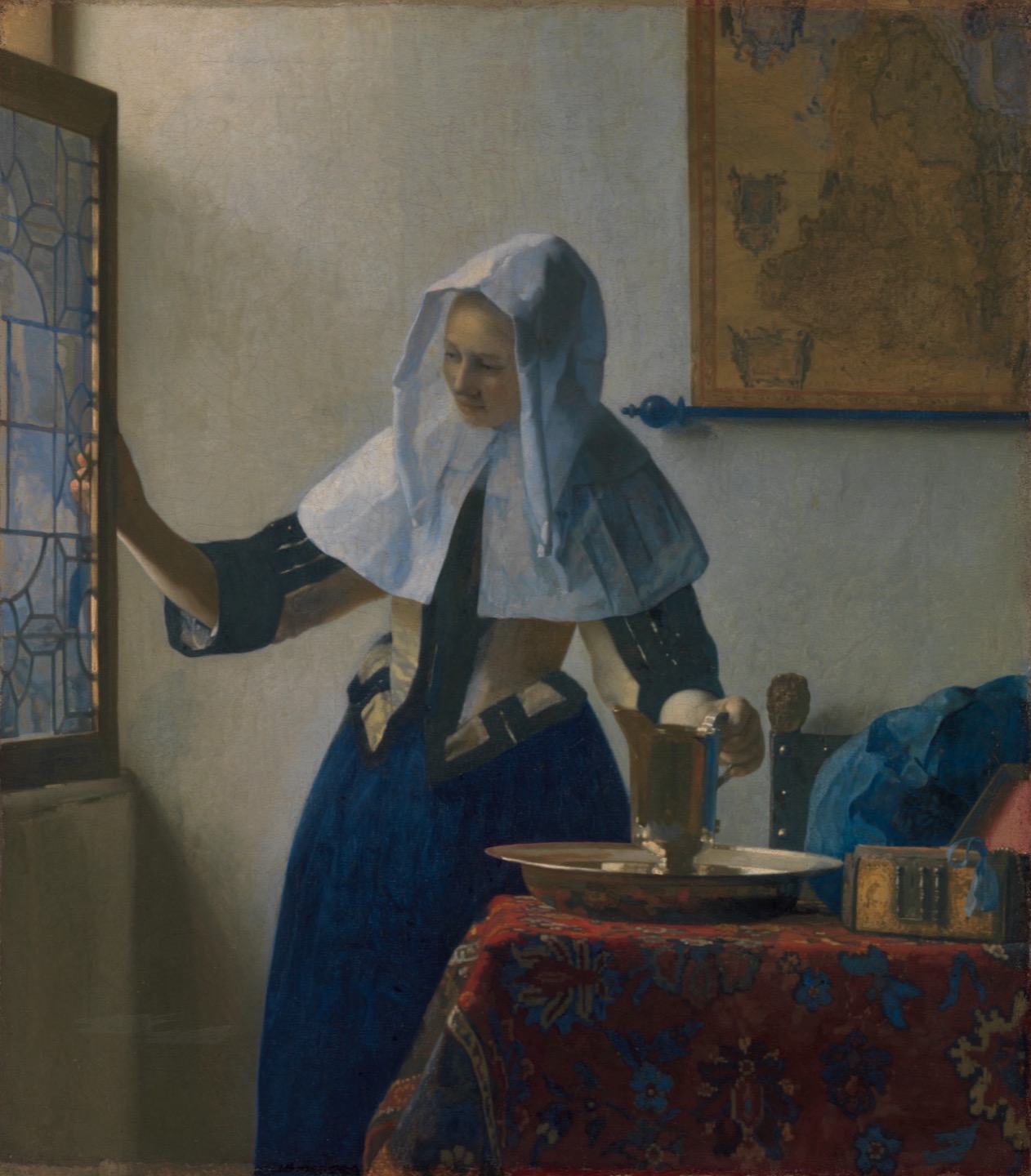 Johannes Vermeer: Junge Frau mit Wasserkanne am Fenster, in tiefblauem Rock